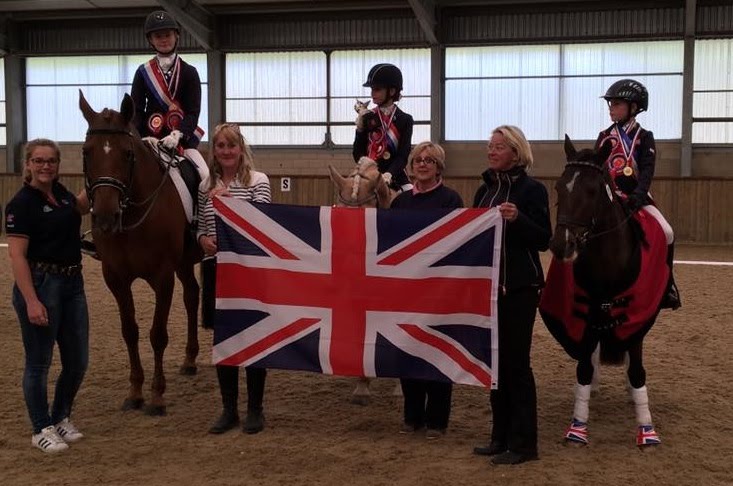 Karen Joynson at National riding competition with union jack flag